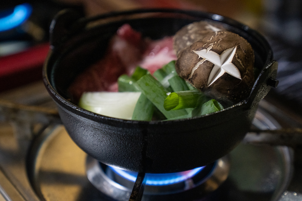 Hot pot of vegetables over the stove