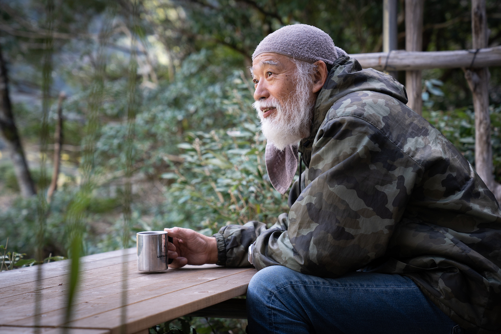 Mountain hermit sitting at table