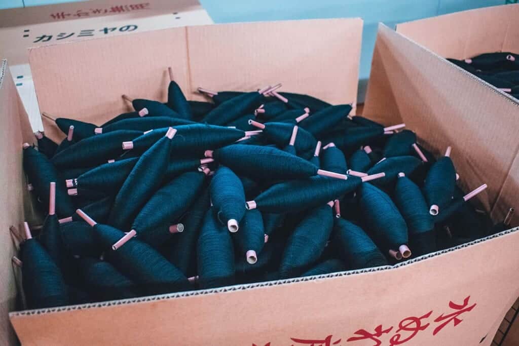 Spools of woollen threads in Japanese factory