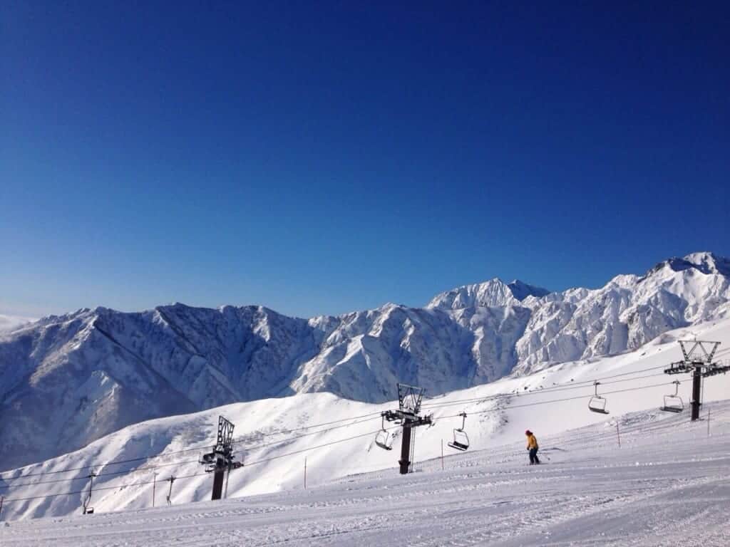 view of ski lifts and mountains in background