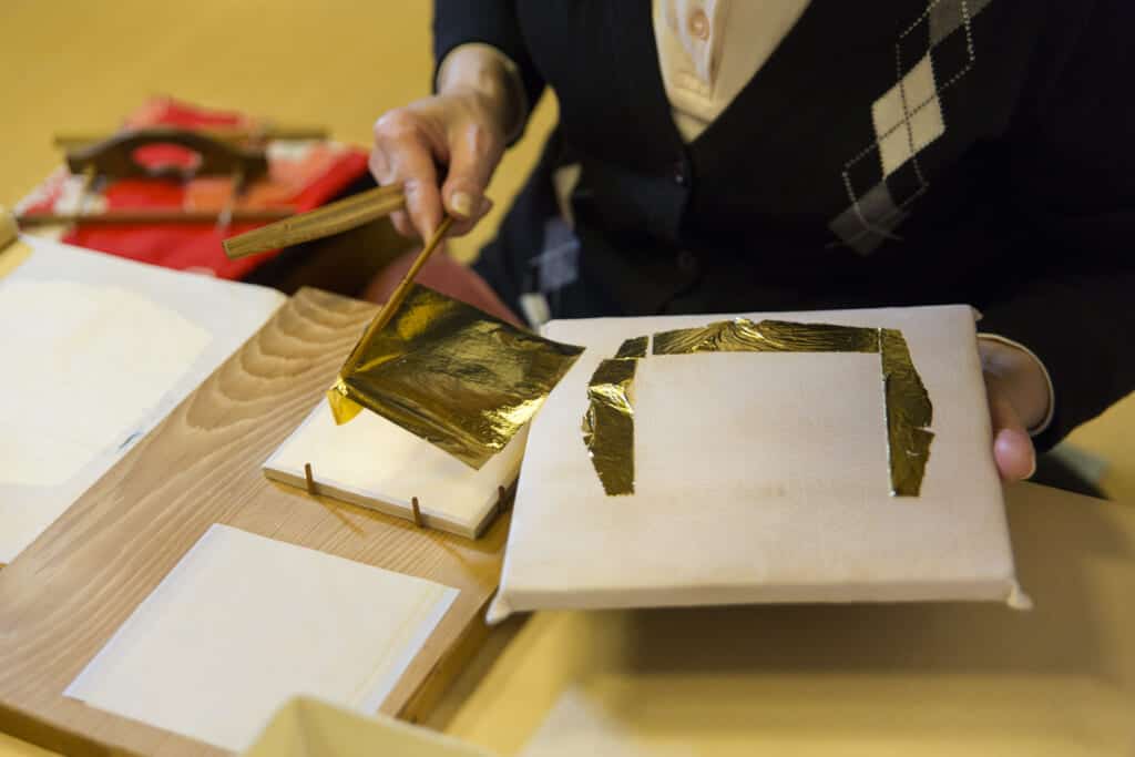 applying gold leaf to card