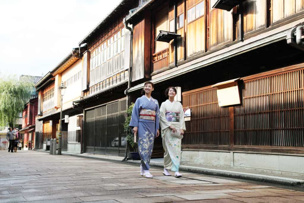 two woman walking through Higashi Chaya district in Kimono