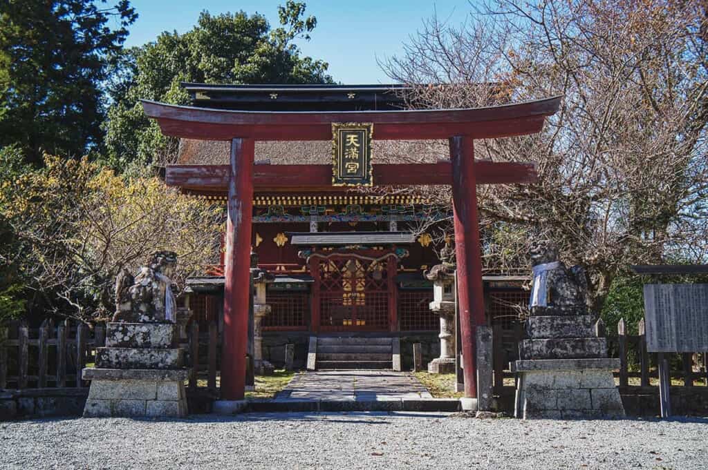 Shinto shrine entrance on Mount Yoshino, guarded by a torii and komainu