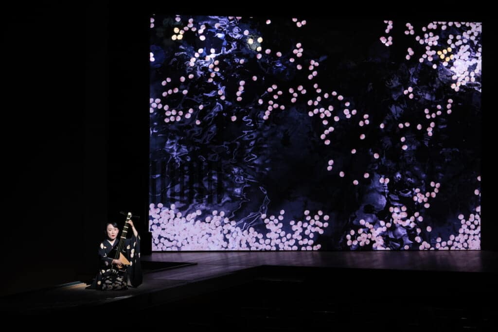Women playing biwa on stage