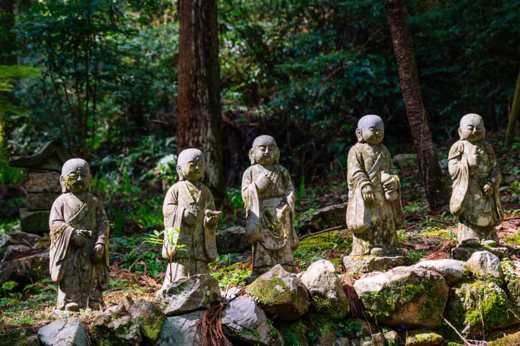 Japanese stone statues in forest
