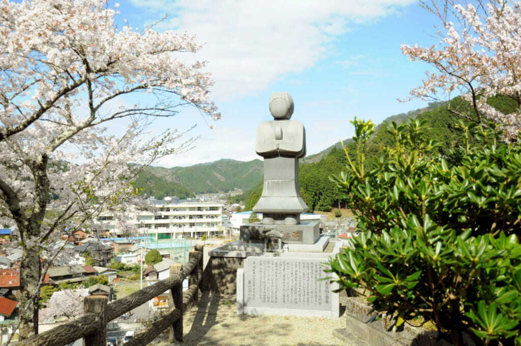 stone statue in a rural Japanese landscape in Gifu, Japan