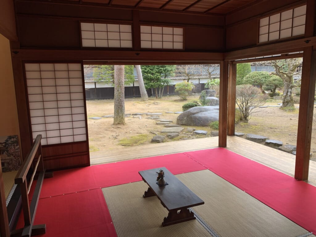 red carpeted tatami room with low table