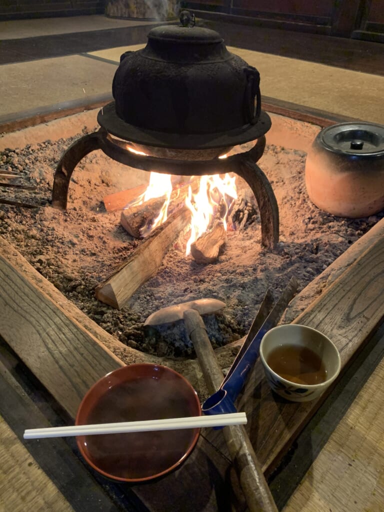 wood fire burning in hearth in JApanese house