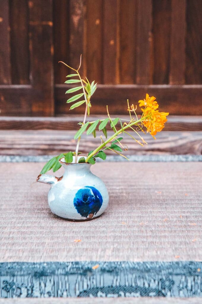 small flowers in Japanese vase a typical wabi sabi approach in Japan