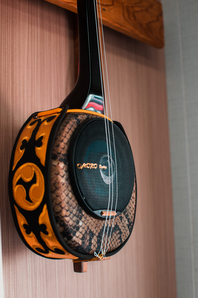 sanshin, an Okinawan traditional instrument, with a speaker