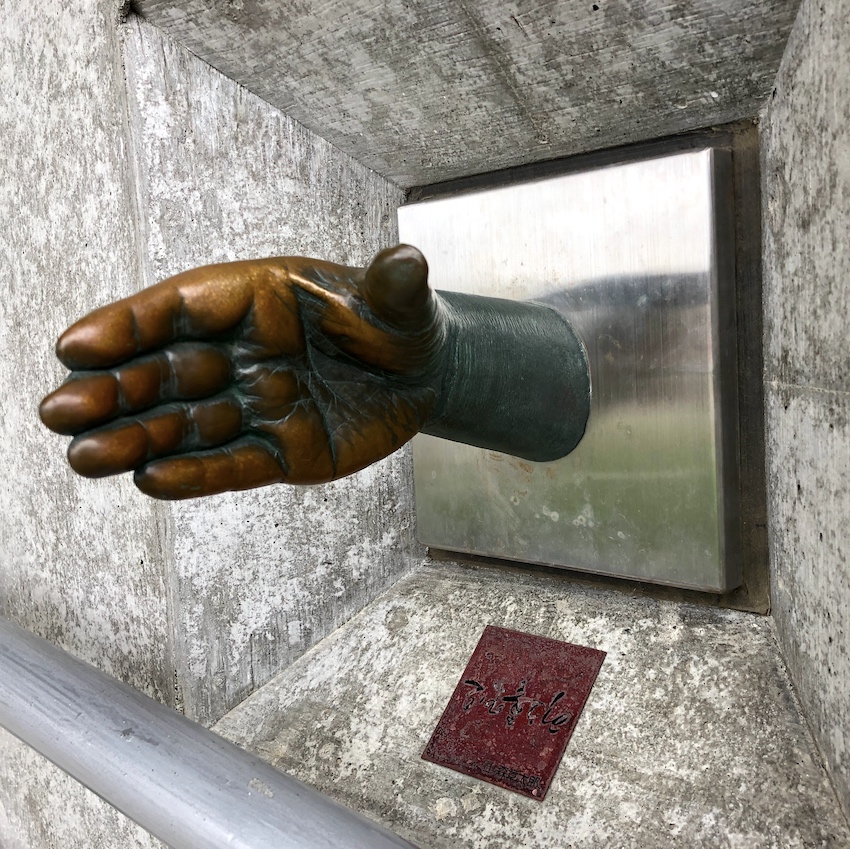 Bronze sculpture of extended hand in Japan