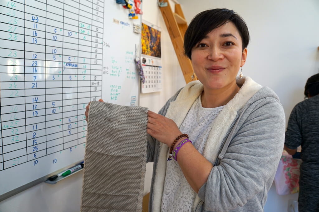 Japanese woman holding fabric in Tohoku region