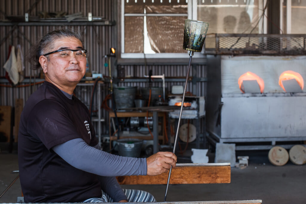 Japanese craftsman, Kaneshi showing his glass in his workshop in Japan