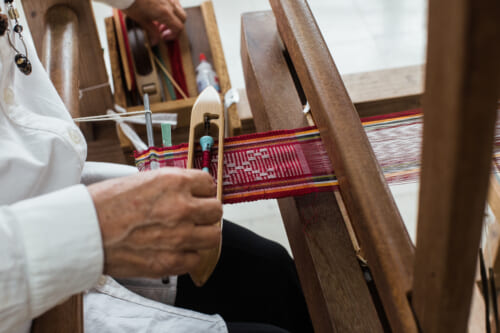 detail of women weaving a japanese textile