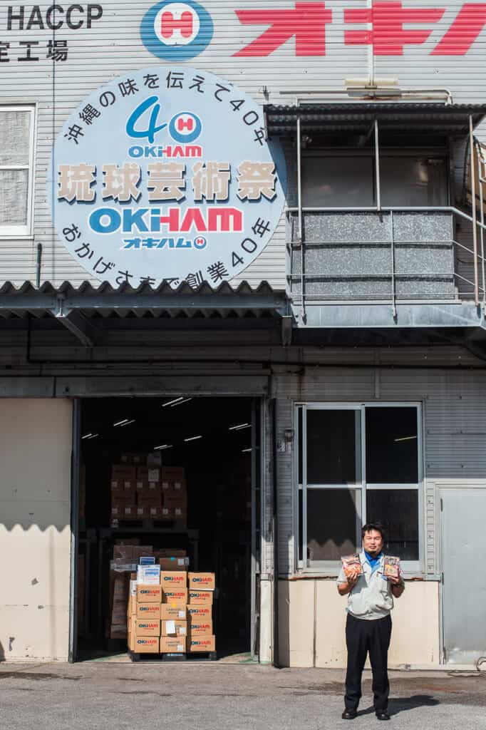 Japanese man in front of food company in Okinawa