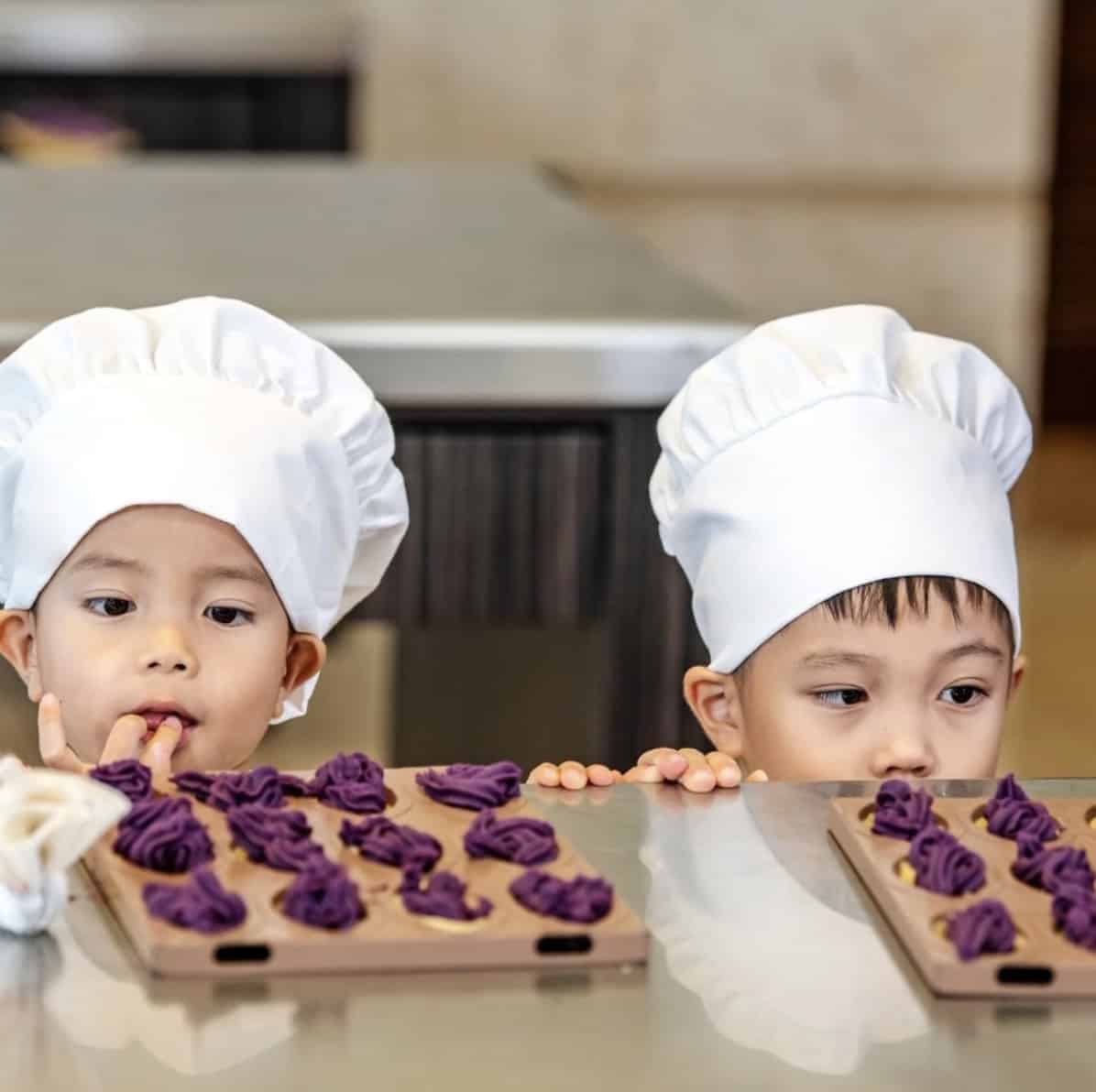 two children looking at some benimo tart, a japanese snacks