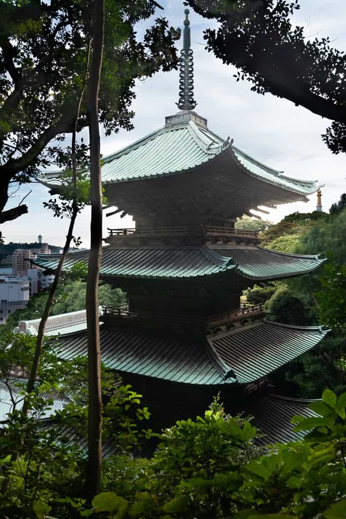 Japanese pagoda seen through trees
