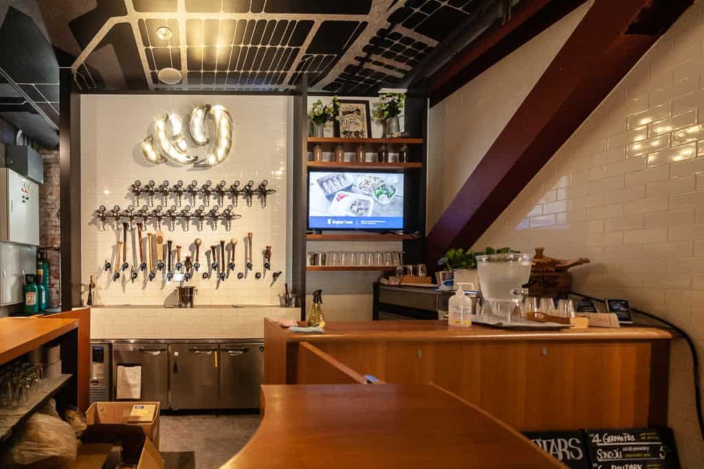 wooden interior of bar with beer taps in Japan