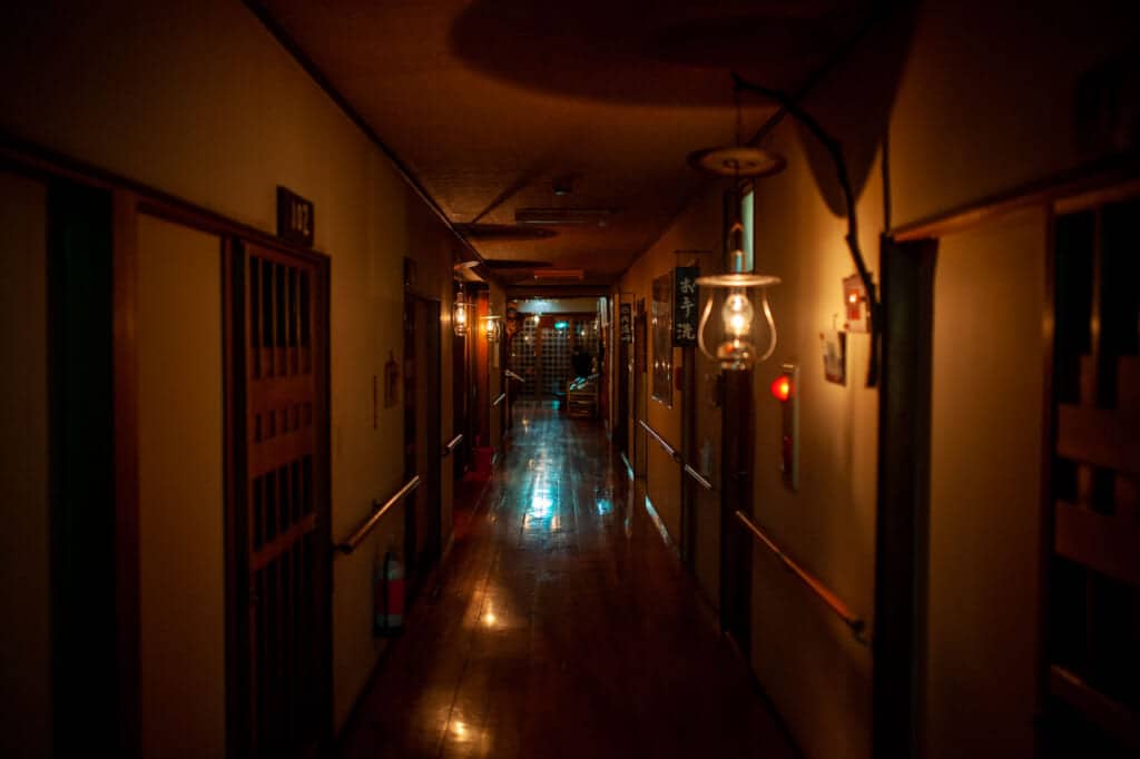 Japanese onsen with no electricity and lit with oil lamps