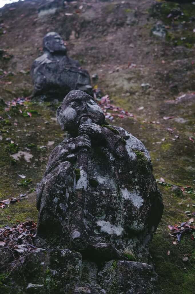 Statue of arhat playing a flute in Japan