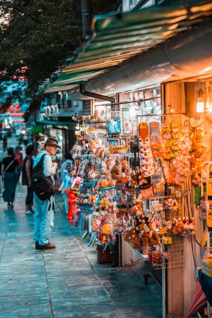 people looking at souvenir stalls in nara