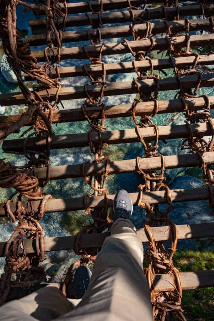 walking across vine bridge in shikoku, japan