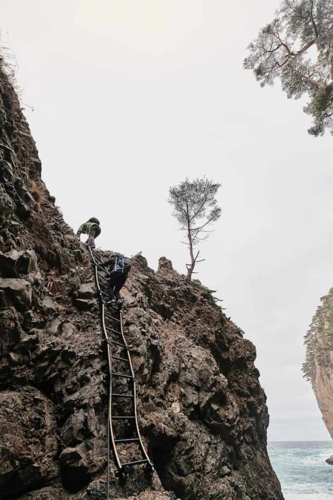 People hiking on a challenging trail on Michinoku Coastal Trail