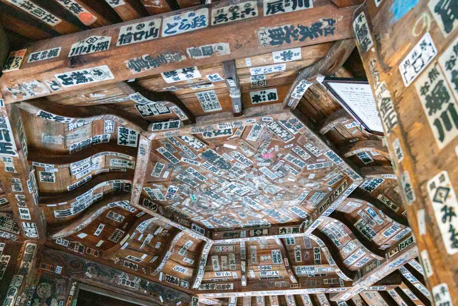 stickers on ceiling inside Sazaedo Temple on Mt Iimoriyama