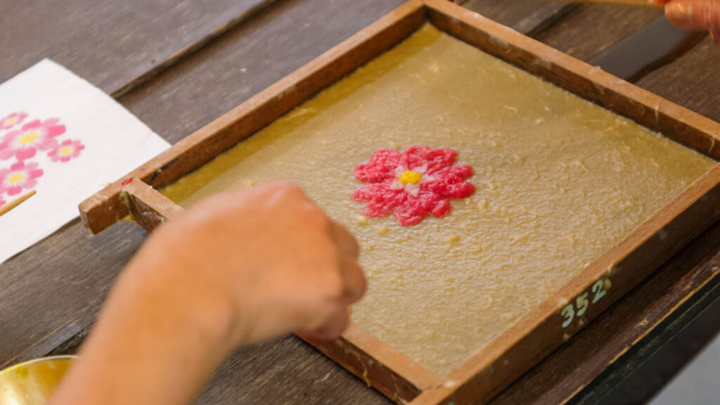 detail of woman  making japanese paper