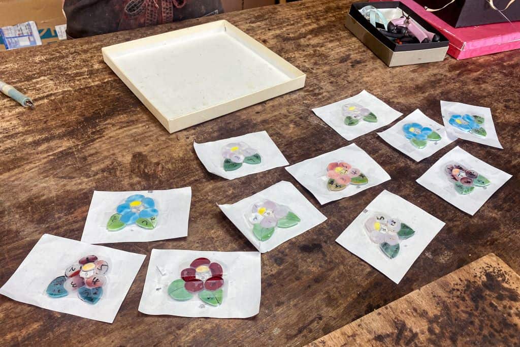 collection of stained glass keychains on table