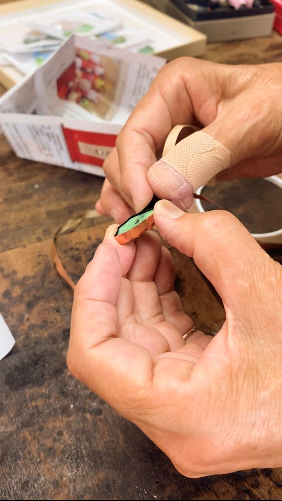 hand working stained glass art