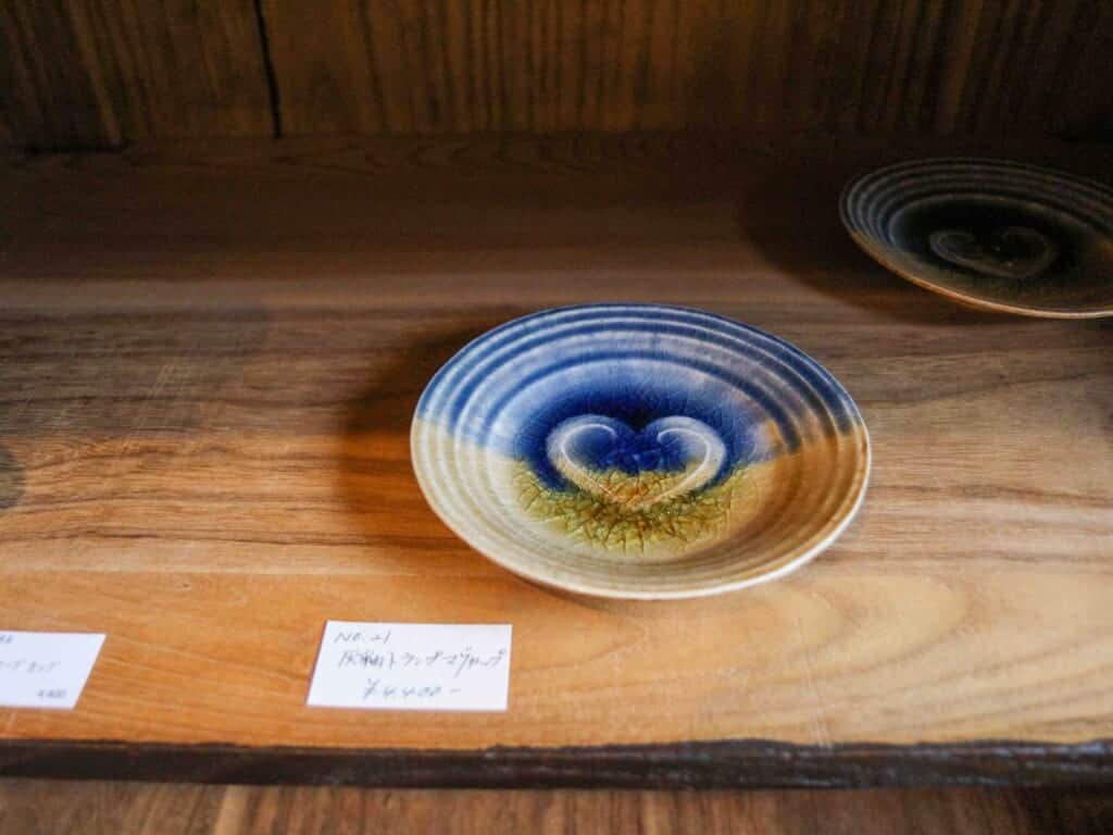 blue and yellow plate with a heart in the middle