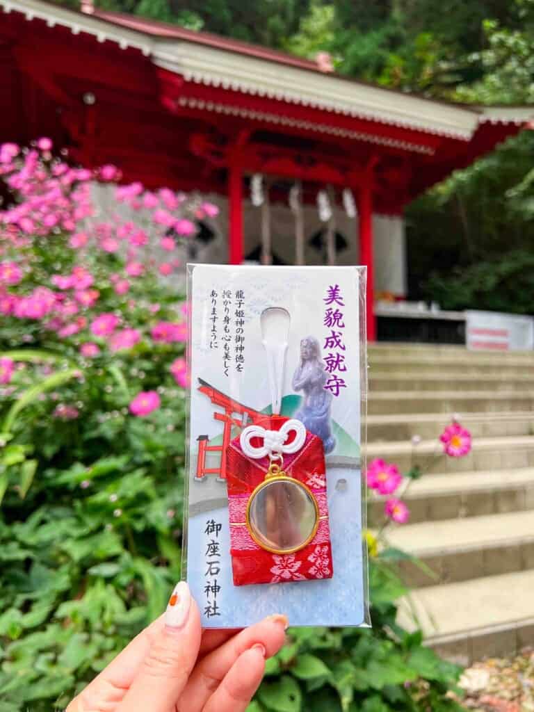 The red amulet with a mirror in the middle