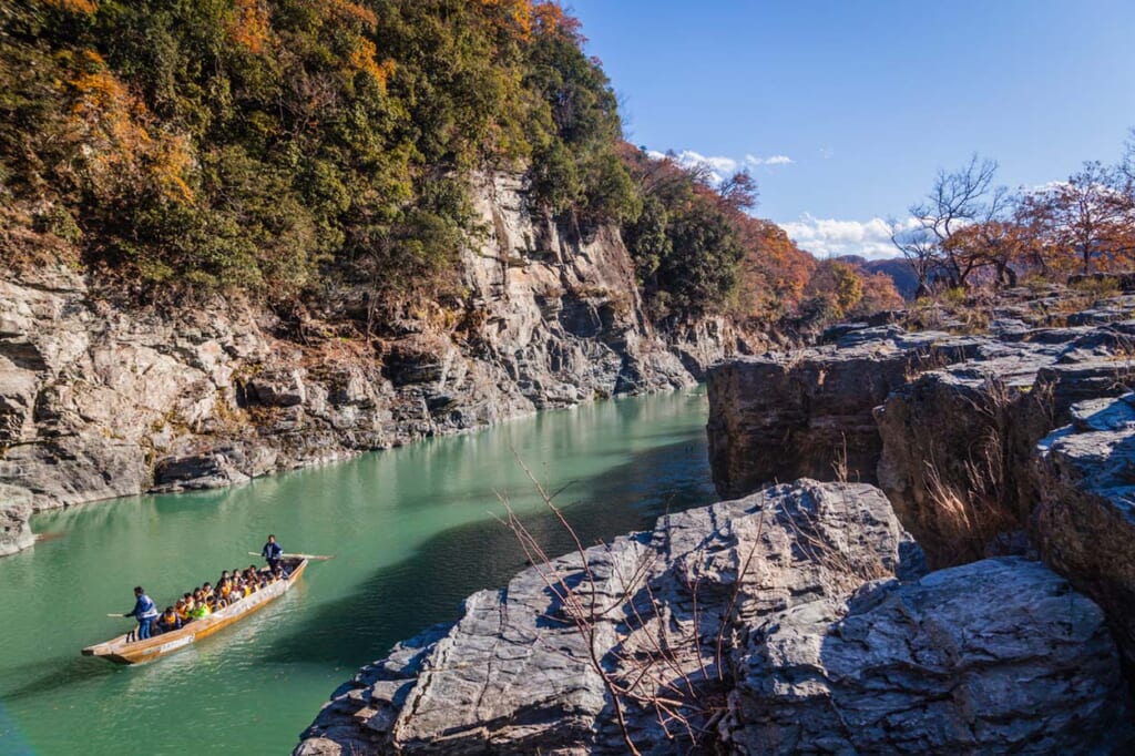 A boat sails on the Arakawa River in Nagatoro, Japan