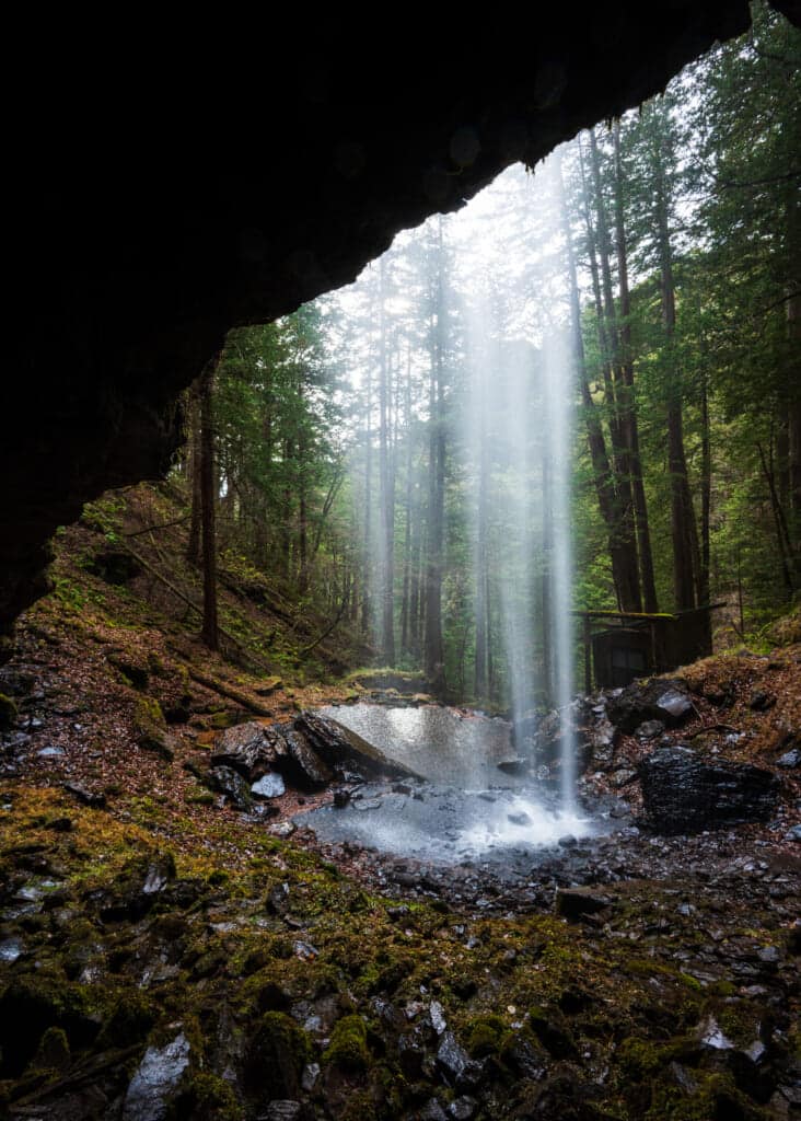A beautiful small waterfall against a wooded backdrop at Mt. Ontake