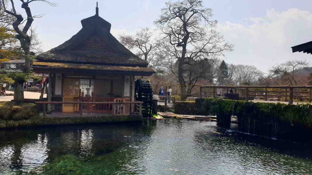 Oshino Hakkai Pond with traditional Japanese thatched roof house