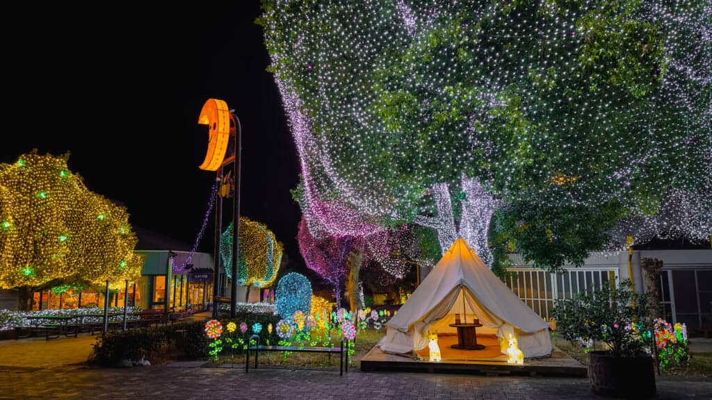 Glamp site tent surrounded by illumination decorations