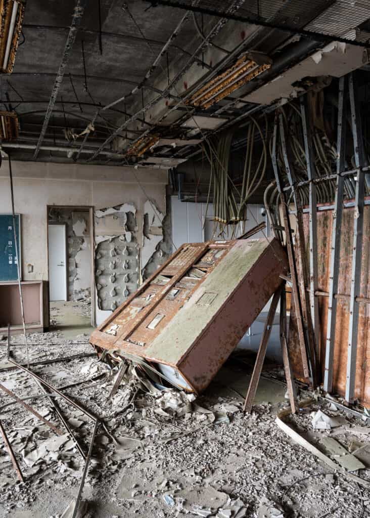 Remains of the Namie Town Ukedo Elementary School with upturned cabinate and exposed ceiling