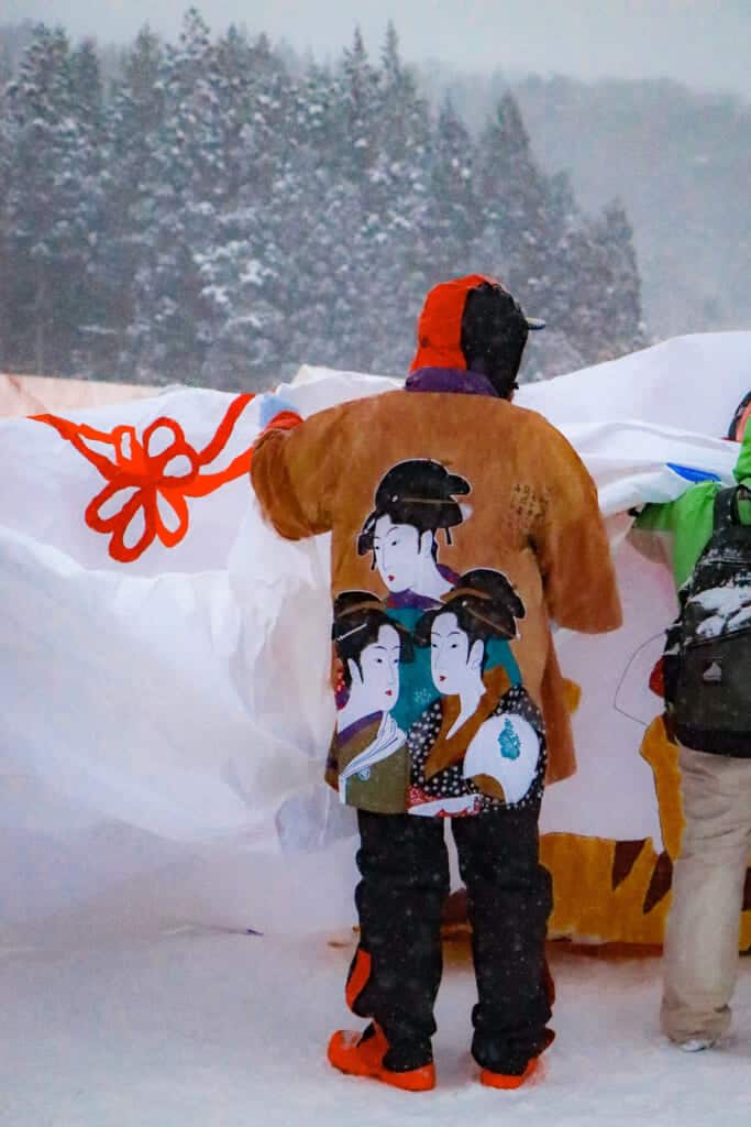 staff preparing to rise a paper balloon