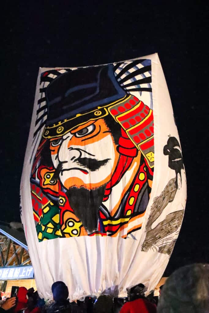 large paper balloon with a painting of samurai