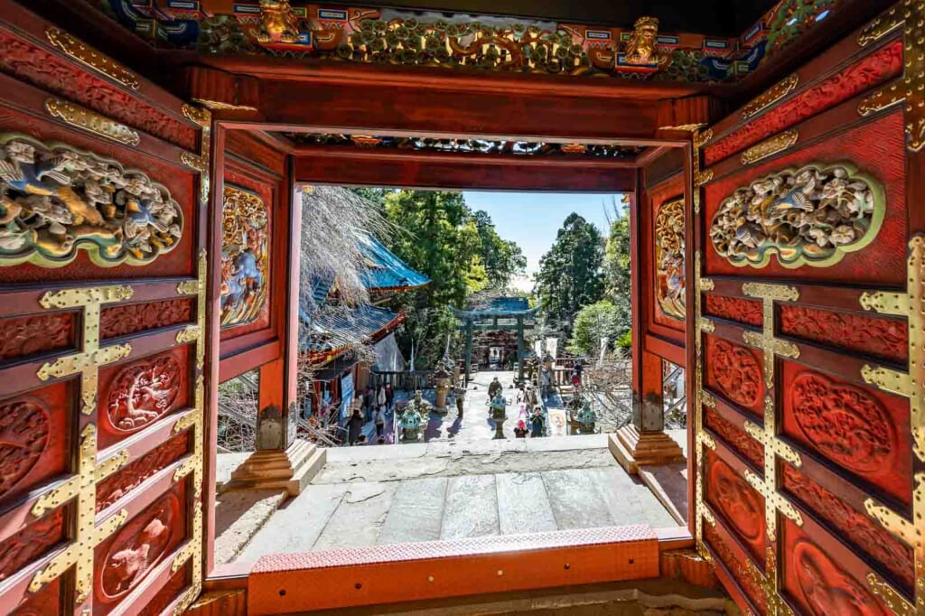 red gateway with gold detailing at Kunozan Toshogu Museum in Shizuoka city, Japan