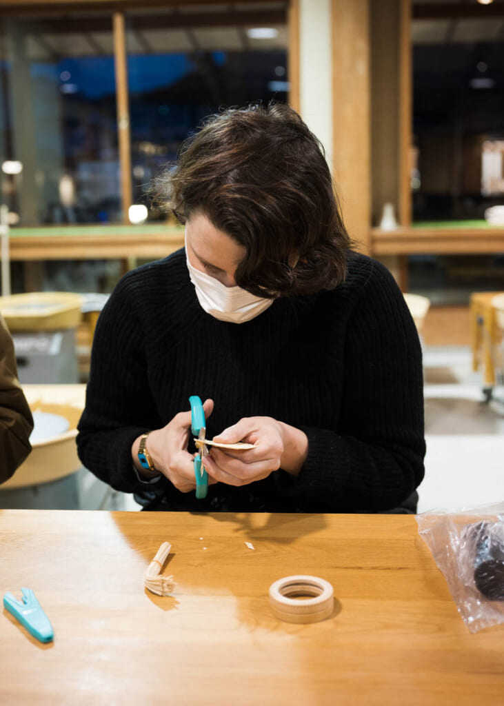 woman  making japanese craft on table in shizuoka,  Japan