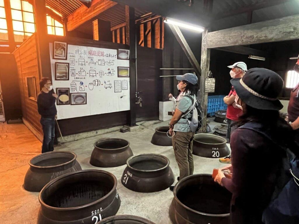 People listening to explanations about shochu.