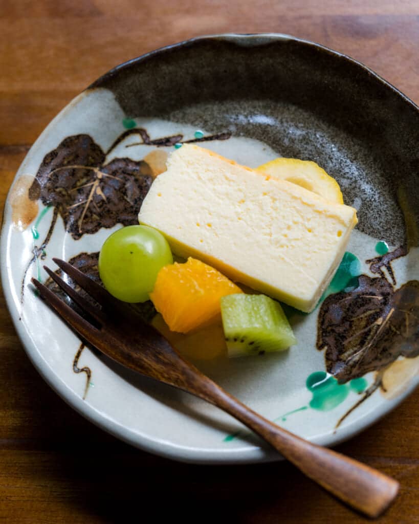 cheese cake with fruit on plate