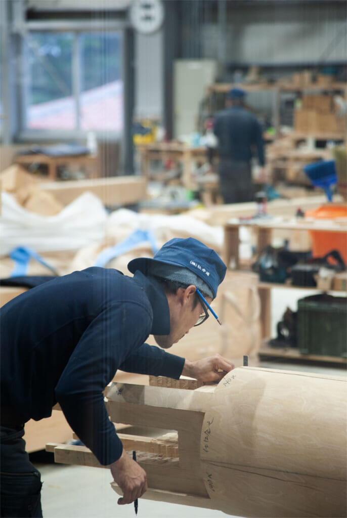 A craftsman works on repairs to the main buildings at Shurijo Castle, Naha, Okinawa