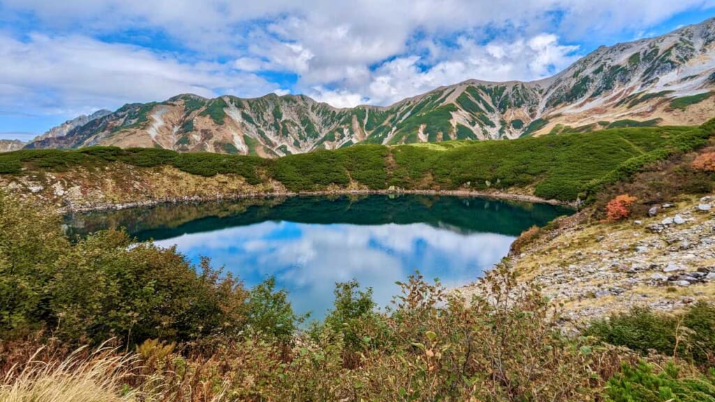Blue sky reflecting in Mikurigaike in Toyama Prefecture, Japan