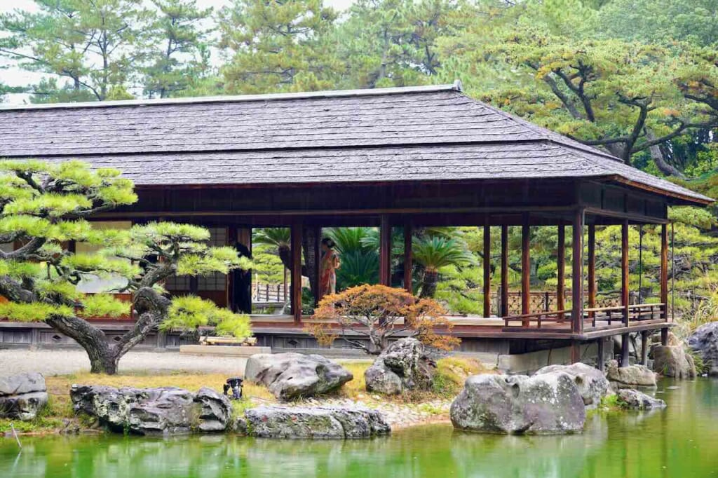 woman wearing kimono inside Kikugetsu-tei open tea house at Ritsurin Garden