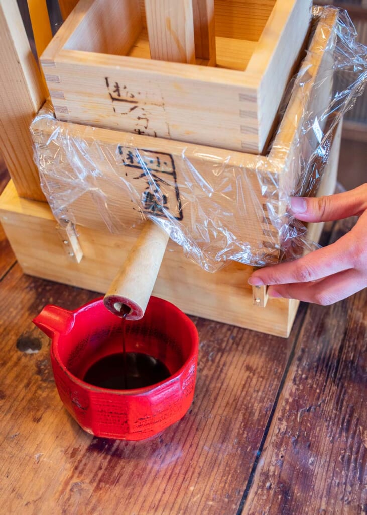 Pressing soy sauce at a brewery in Hamamatsu, Japan