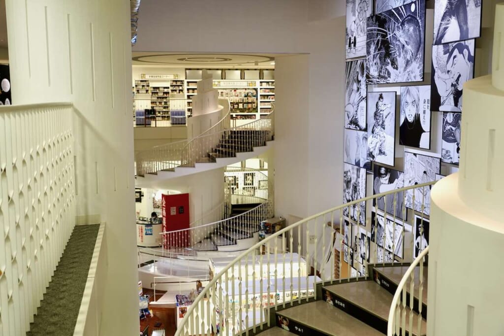 Yokote Masuda Manga Museum staircases and mural montage