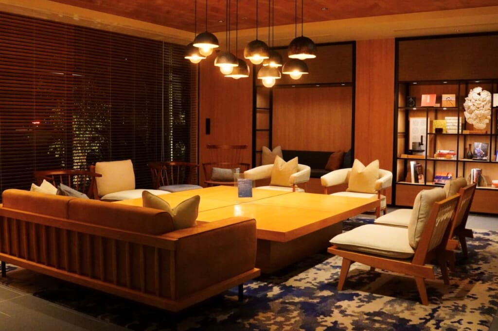 Warmly lit tables and chairs in a spacious lobby area of Fairfield by Marriott (Kyoto Minami Yamashiro)